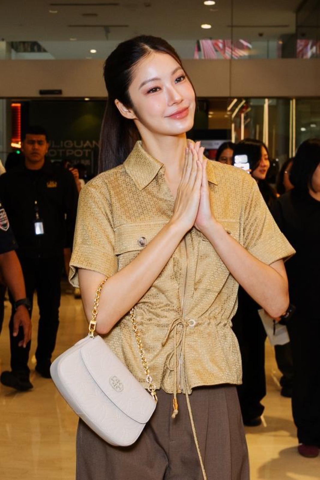 Namtan Tipnaree carrying a cream BONIA leather bag at Pavilion Kuala Lumpur