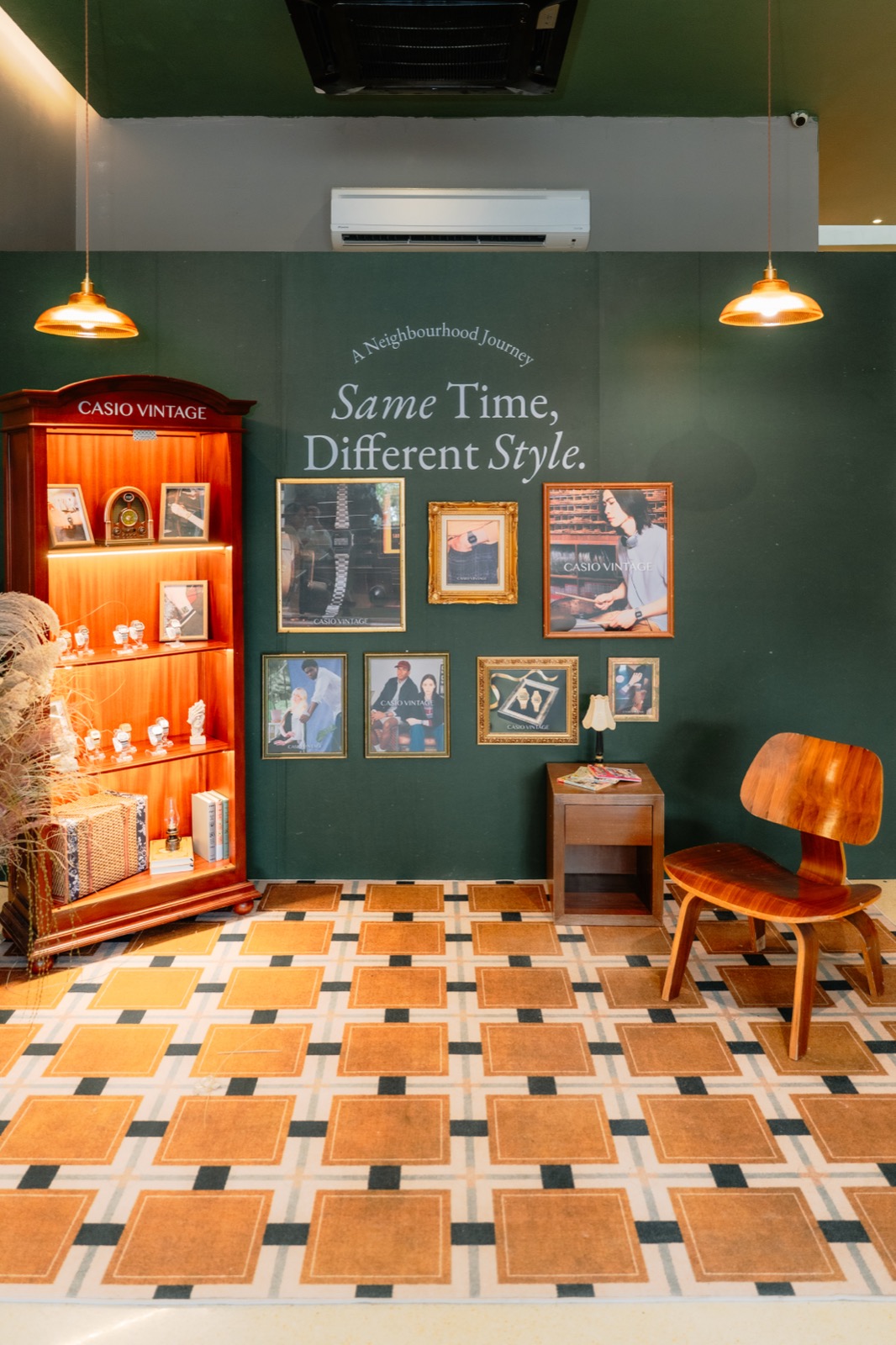 CASIO Vintage Same Time Different Style pop-up room in Taman Paramount with a wooden display cabinet, framed vintage watch photos and a green feature wall
