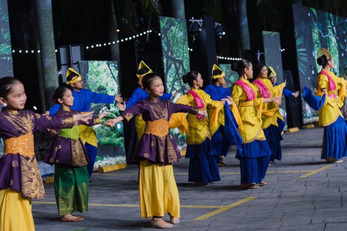Young dancers in blue, yellow and purple regional costume perform during the Colours of Parade at Citrawarna Speed Festival 2026