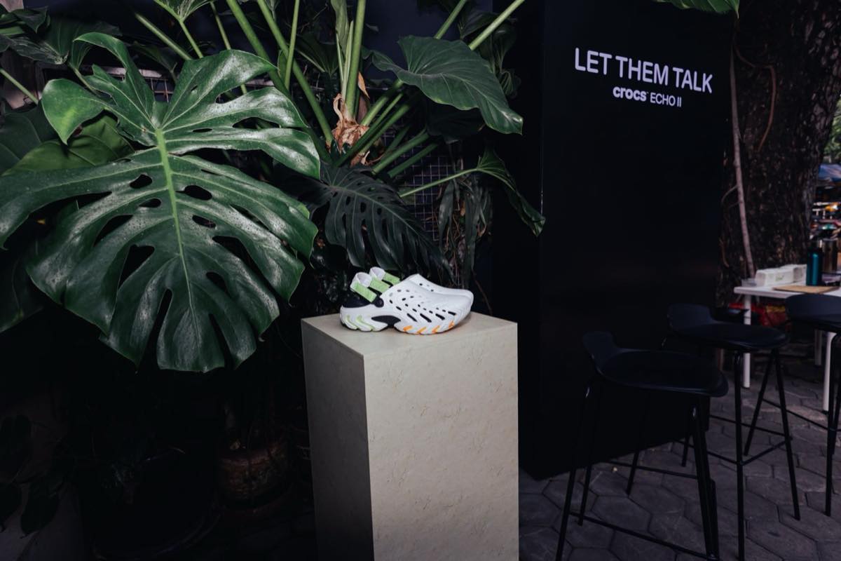 Crocs Echo II clog displayed under the Let Them Talk campaign backdrop