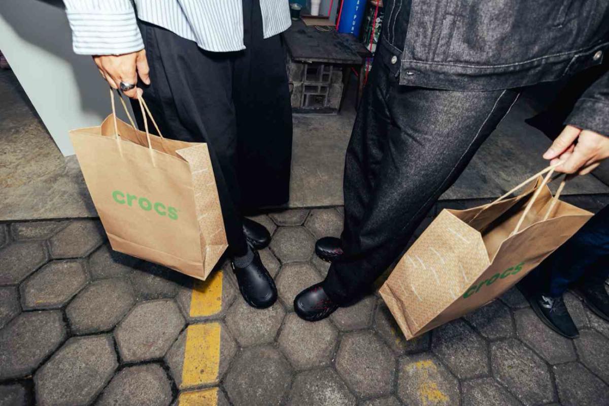 Guests at the Crocs Let Them Talk event in Jakarta carrying Crocs shopping bags