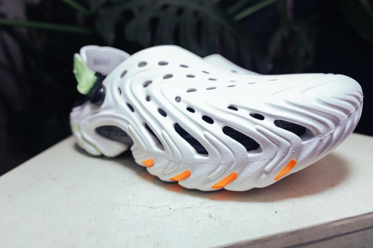 White Crocs Echo II clog shown in side profile on a plinth