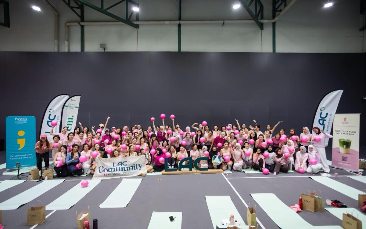 The 85 women who attended the LAC Community and FemFamm Pink October morning gathered for a group photo