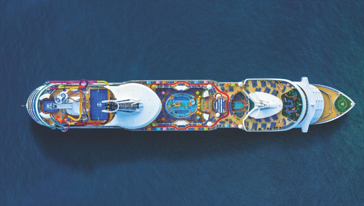 Aerial view of Navigator of the Seas and its full top deck of pools and attractions