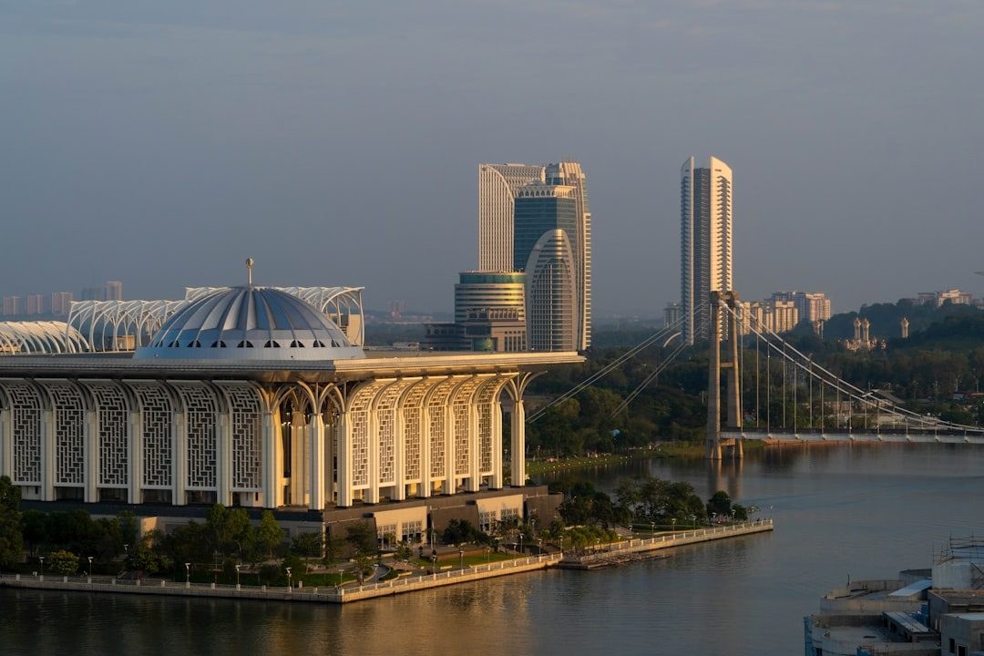A bridge over the lake in Putrajaya framed by the city skyline